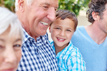 Fototapeta premium Family, portrait and smile of boy with grandfather in backyard of home for bonding or visit. Love, security or trust and happy child with grandparents outdoor together for development or growth
