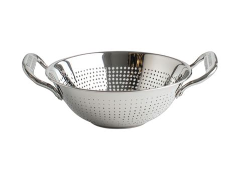 Shiny metal colander with handles and small drainage holes on black background