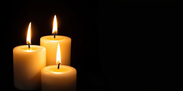 Three burning candles provide warm light in the dark, symbolizing hope, memorial, and celebration, with copy space - Powered by Adobe