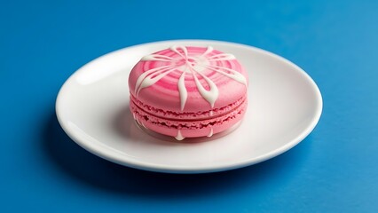 Pink Macaron with White Swirl Icing on a White Plate pastry cookie