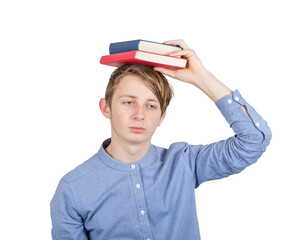 Exhausted teenage guy keeps books on his head has to prepare for exams and feeling overwhelmed, depressed. Concept of difficult education
