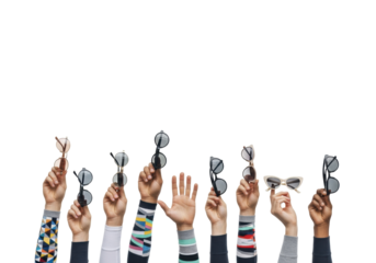 Diverse hands, unique patterned socks, stylish sunglasses, rising against a transparent studio background with copy space. Concept of collaborative innovation