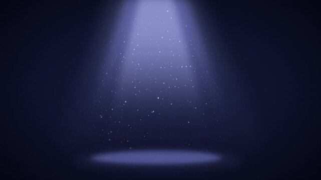 Dramatic spotlight shining on a dark stage with floating specks of dust creating a magical mood and captivating attention in a theater setting