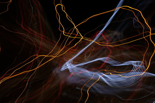 Swirling Electric Streams: Long Exposure Light Trails Abstract
