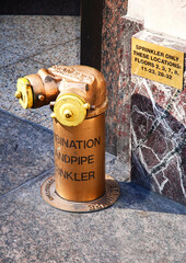 Standpipe connection detail on Manhattan street New York USA urban architecture city infrastructure photography