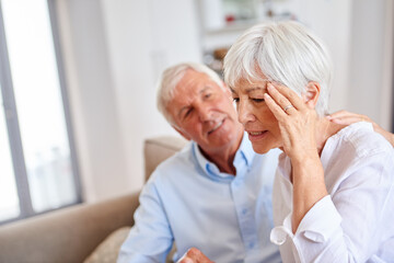 Sad, comfort and crisis with old couple on sofa for empathy, support and kindness. Depression, trust and connection with senior man and woman in living room of home for grief, compassion and care