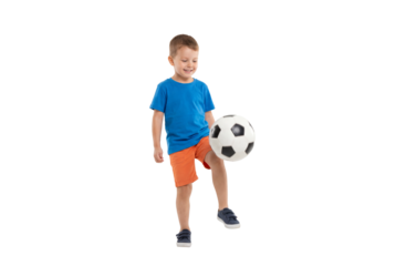 Young boy juggling a soccer ball on isolated background, active childhood play and beginner football skills for youth sports training and physical education concepts
