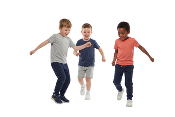 Three young boys playing soccer indoors on a white background, joyful childhood fitness and teamwork with active kids kicking ball in casual sportswear for school and recreation themes