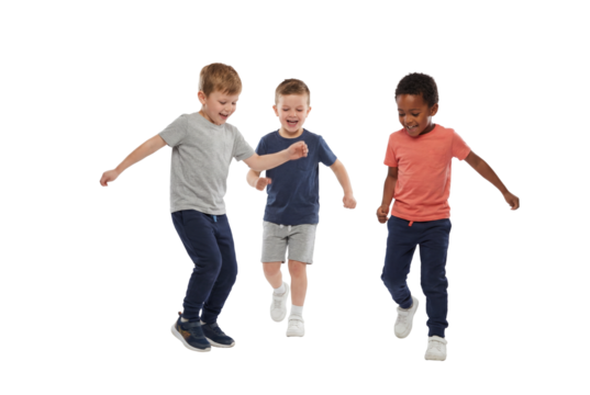 Three young boys playing soccer indoors on a white background, joyful childhood fitness and teamwork with active kids kicking ball in casual sportswear for school and recreation themes