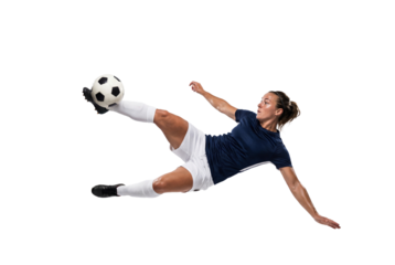 Female soccer player performing airborne bicycle kick on isolated black background, athletic action and competitive sports concept for training, fitness motivation and team game promotion
