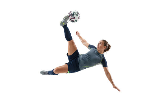 Female soccer player performing acrobatic bicycle kick in midair on white background, athletic action and football skill for sports training, competition and youth inspiration - Powered by Adobe