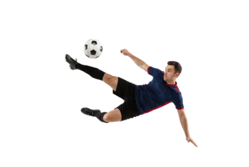 Male soccer player performing flying kick with focus on ball in mid air, action sports concept for competition training, athletic skill and dynamic movement isolated on transparent background