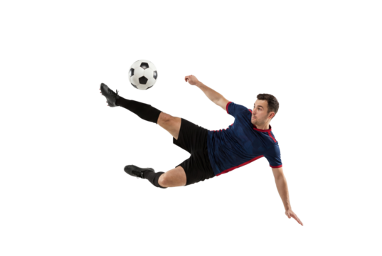 Male soccer player performing flying kick with focus on ball in mid air, action sports concept for competition training, athletic skill and dynamic movement isolated on transparent background