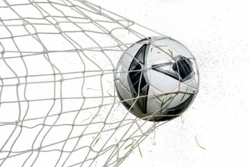 Soccer ball hitting the back of the goal net with flying grass and water droplets at night, sports action and celebration moment for competition, victory and team motivation