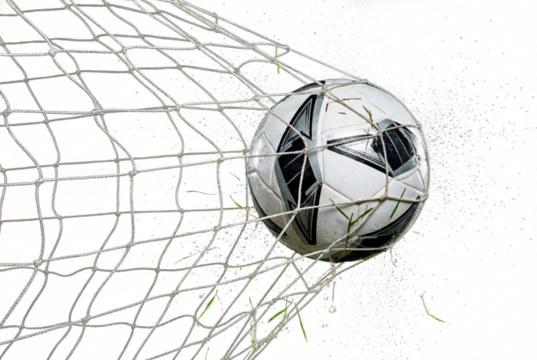 Soccer ball hitting the back of the goal net with flying grass and water droplets at night, sports action and celebration moment for competition, victory and team motivation