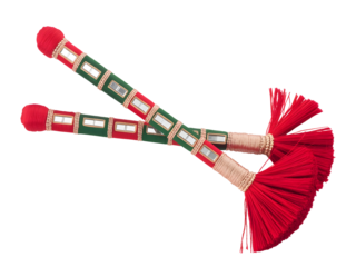 Vibrant traditional Indian dandiya sticks with red tassels and mirror work decoration isolated on transparent background