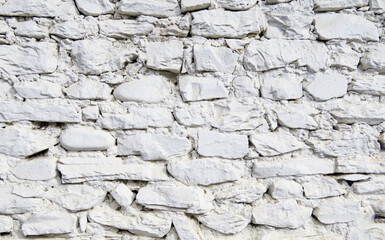A detailed white stone wall texture made of natural rough rocks, perfect for backgrounds, architectural design, 3D modeling, graphic overlays, construction themes, and building material presentations.