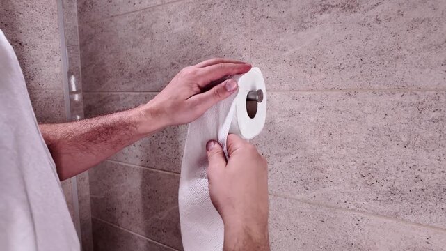 Man with urge to go to the toilet at home.