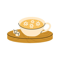 Warm chamomile tea cup with floral details and sugar cubes on a wooden coaster