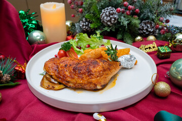 A delicious plate of roasted chicken and vegetables, perfect for a festive feast. The chicken is cooked to perfection, surrounded by a medley of fresh, colorful vegetables