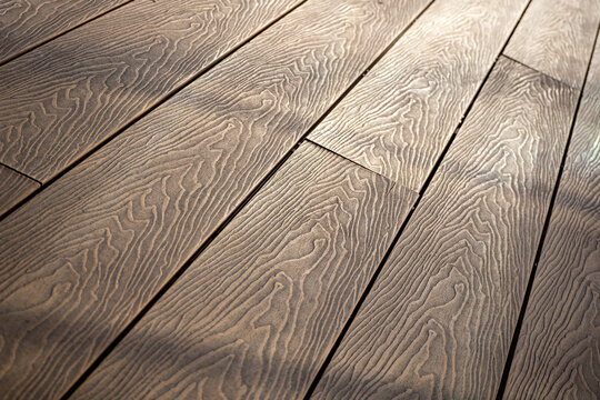 Wood plastic composite decking boards. Decking board, diagonal laying. Building background