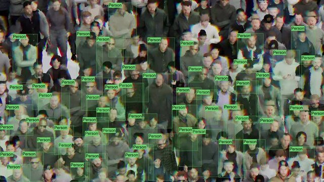 A visual representation of machine learning. A computer vision algorithm that analyzes a crowd using labeled green and purple frames.