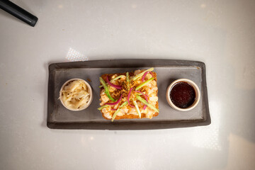 Creative sushi sandwich presented with clean, minimalist food styling.