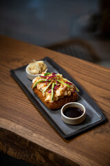 Creative sushi sandwich presented with clean, minimalist food styling.