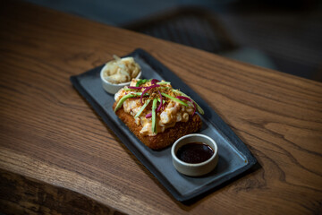 Creative sushi sandwich presented with clean, minimalist food styling.