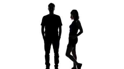 Two full-body silhouettes, a man and a woman, standing against a transparent background. Faces are subtly visible, creating a striking contrast. background removed