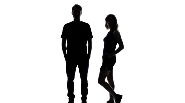 Two full-body silhouettes, a man and a woman, standing against a transparent background. Faces are subtly visible, creating a striking contrast. background removed