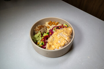 Fresh chicken bowl served with vegetables and grains in a clean, colorful presentation.