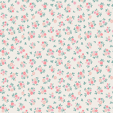 Beautiful floral pattern in small flowers. Small pastel pink, coral and red flowers. Ecru background. Ditsy print. Floral seamless background. Liberty template for fashion prints. Stock flowers art