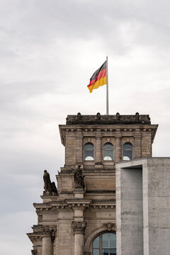 Berlin dome architecture with the German flag expressing identity, heritage and symbolism against a clean European sky, highlighting strong civic design