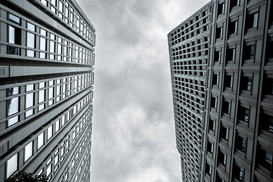 Vertical perspective of Berlin towers featuring steel geometry, strong contrast and modern architecture defined by sharp lines rising into the sky