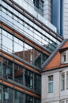 Modern Berlin facade with strong contrast in lines and structure, featuring glass surfaces and clean reflection creating a sharp architecture profile with precise urban detail