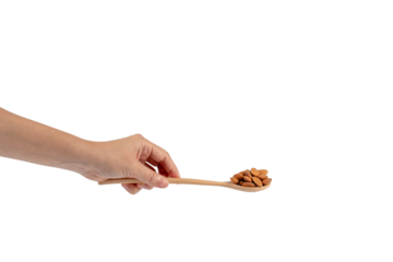 Wooden spoon with almonds in hand on transparent background