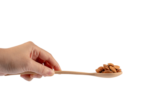 Wooden spoon with almonds in hand on transparent background - Powered by Adobe
