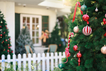 close-up view, christmas tree with item to decorate, white fence and blure christmas decorate on background, celebrate in christmas holiday
