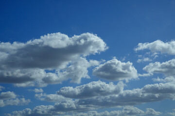 Blue sky with white cumulus clouds developing