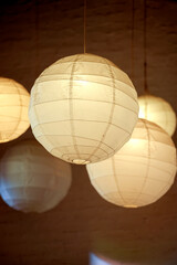 Paper lanterns illuminating warm light creating ambiance interior
