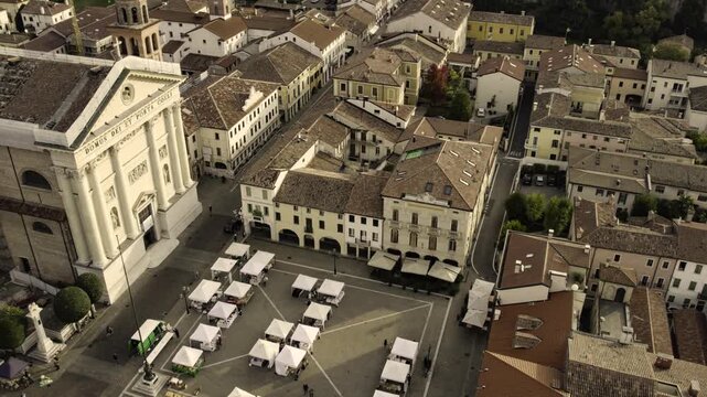 Drone flying above a market in cittadella town square, italy