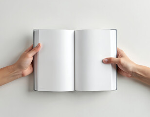 Hands hold open blank book on white surface. Simple composition with empty paper sheet. Ready for design presentation advertising. Ideal for literary ideas promotion, showcase. Mockup template for