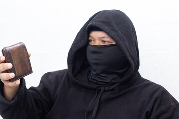A close-up view of a classic red and white vintage motorcycle with chrome accents, showcasing its front wheel and headlight at a motor show
