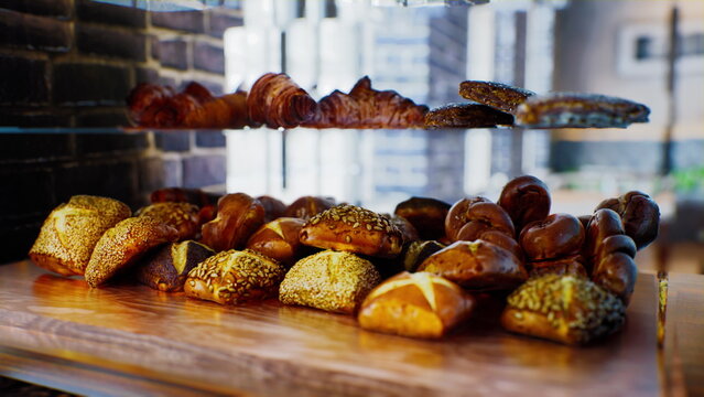 Delicious assorted pastries rest on a wooden shelf in a cozy bakery. The inviting aroma fills the air as customers eagerly browse the freshly baked treats on a sunny morning.