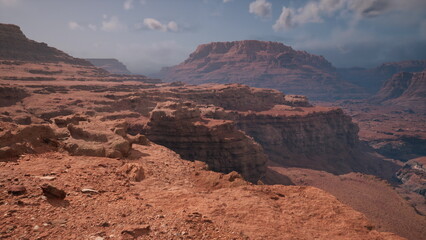 Breathtaking vistas of rugged red rock formations stretch across the horizon, bathed in sunlight and dotted with dramatic clouds. The vast landscape invites awe and exploration.