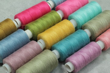 Close up, multi colored sewing threads and needlework. flat lay or top view.