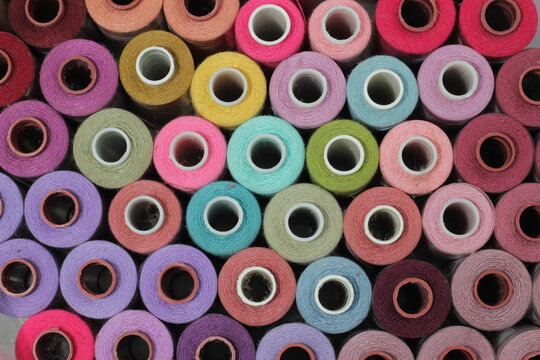 Close up, multi colored sewing threads and needlework. flat lay or top view.