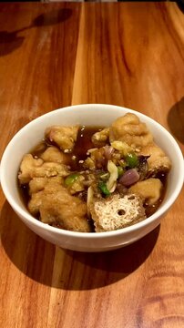 Tahu gejrot is traditional street food made from fried tofu (bean curd) with crushed shallot and green chili in sweet soy and sugar sauce. Typically food from Cirebon, West Java.