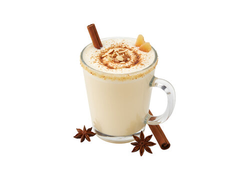 A glass of warm eggnog, a festive drink made with eggs, cinnamon, almonds, and rum liqueur. Set against a white background.